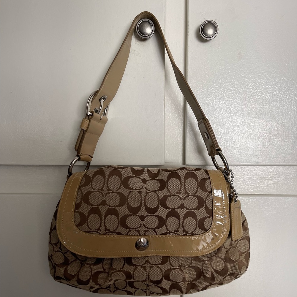 Coach tan and brown shoulder bag. Lilac interior.